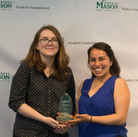 Picture of two women holding an award